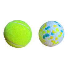 Size comparison of small/medium ball showing the ball is comparable in size to a standard tennis ball